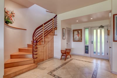 Enter in style! This grand staircase and sunlit foyer set the scene for an upscale island getaway you'll never forget KRV-722