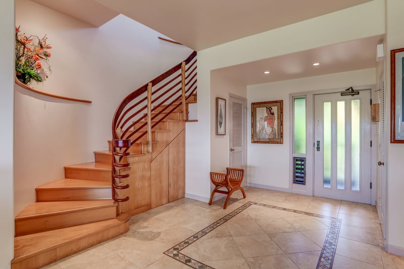 Enter in style! This grand staircase and sunlit foyer set the scene for an upscale island getaway you'll never forget KRV-722