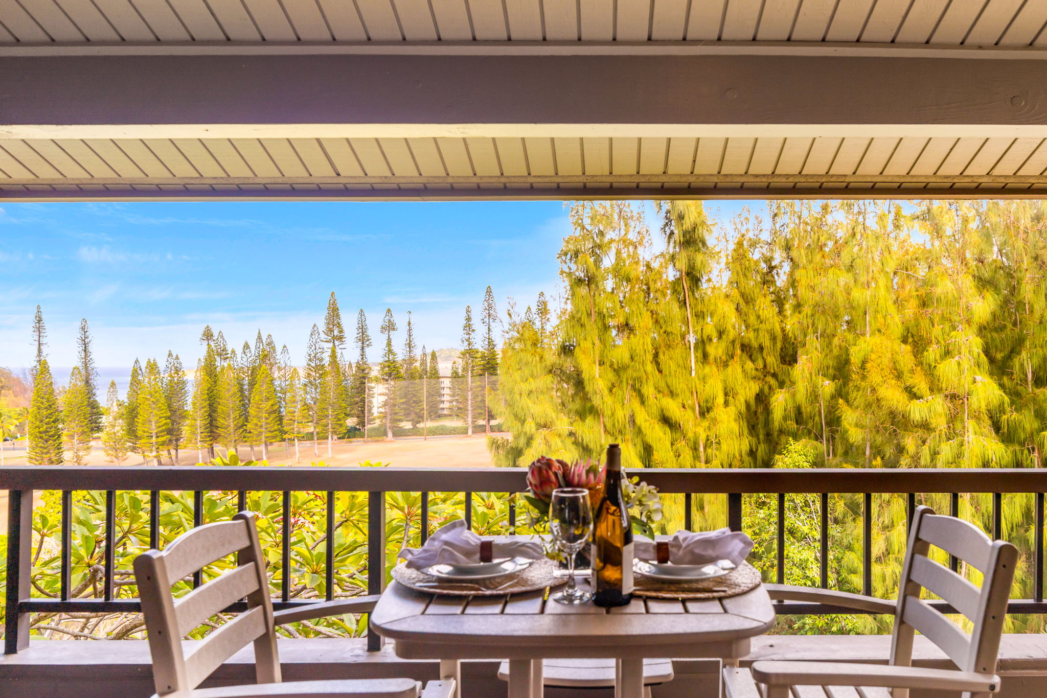 Lanai with elevated views over trees and resort grounds.