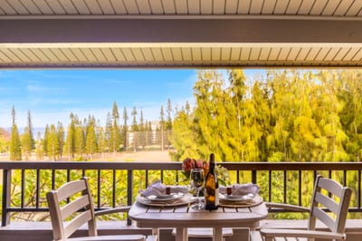 Lanai with elevated views over trees and resort grounds.