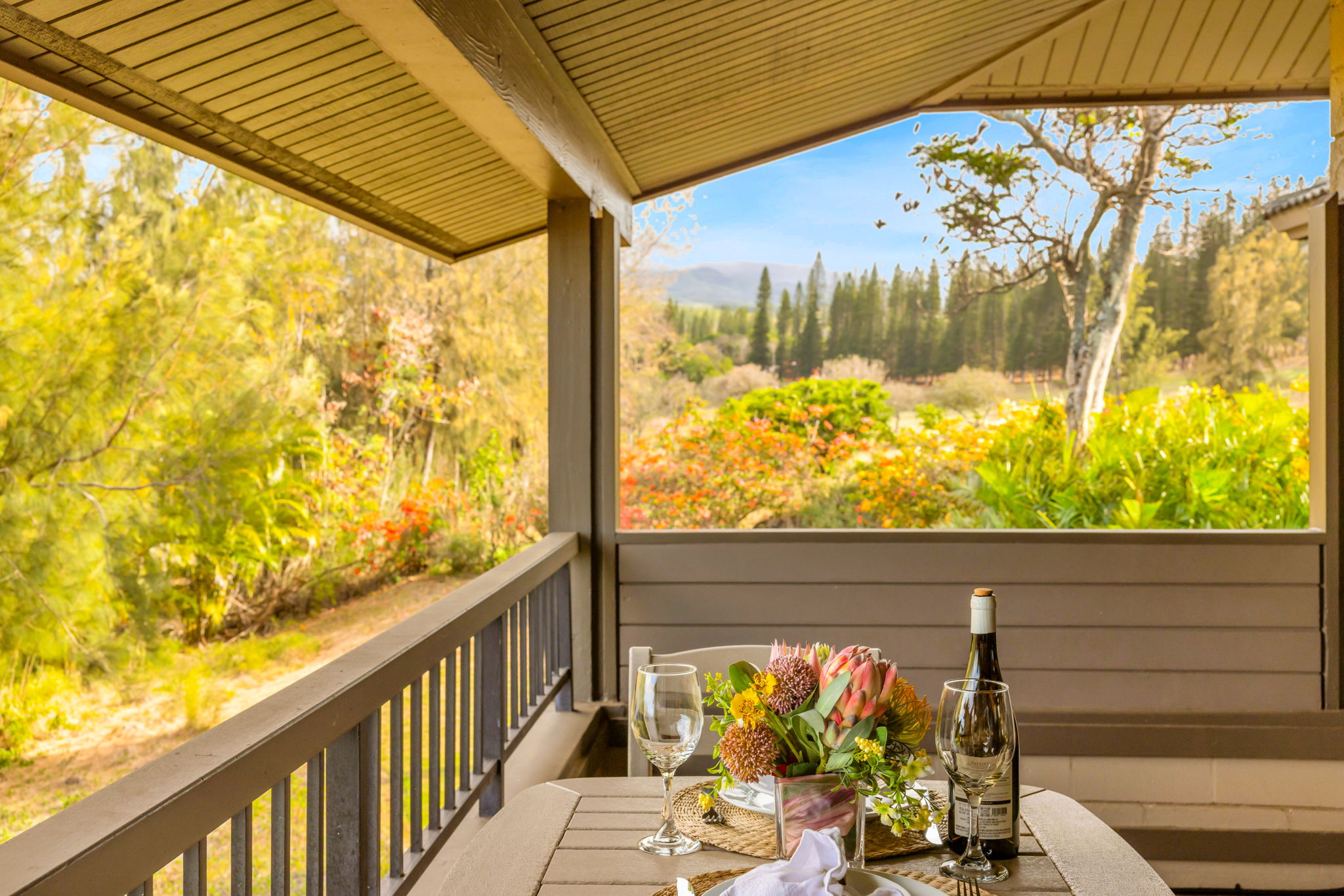 Partial ocean and treetop views make this lanai spot perfect for sunset cocktails.