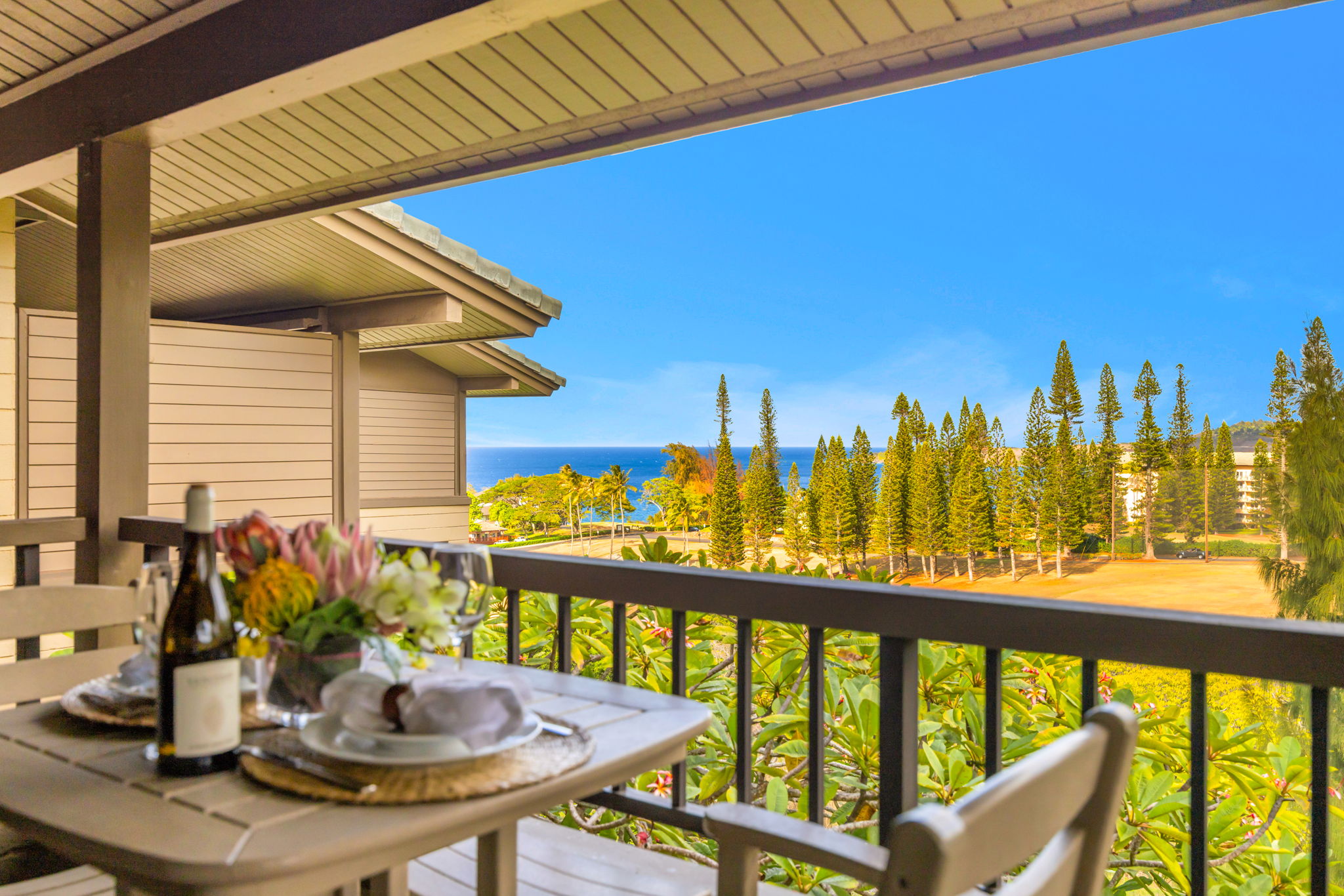 Look out across vibrant greenery and forested slopes from your open-air lanai.
