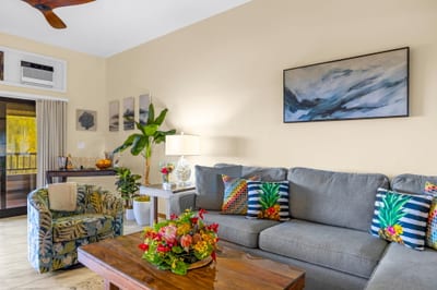 Relax in your coastal-inspired living area with ceiling fan and large Smart TV.