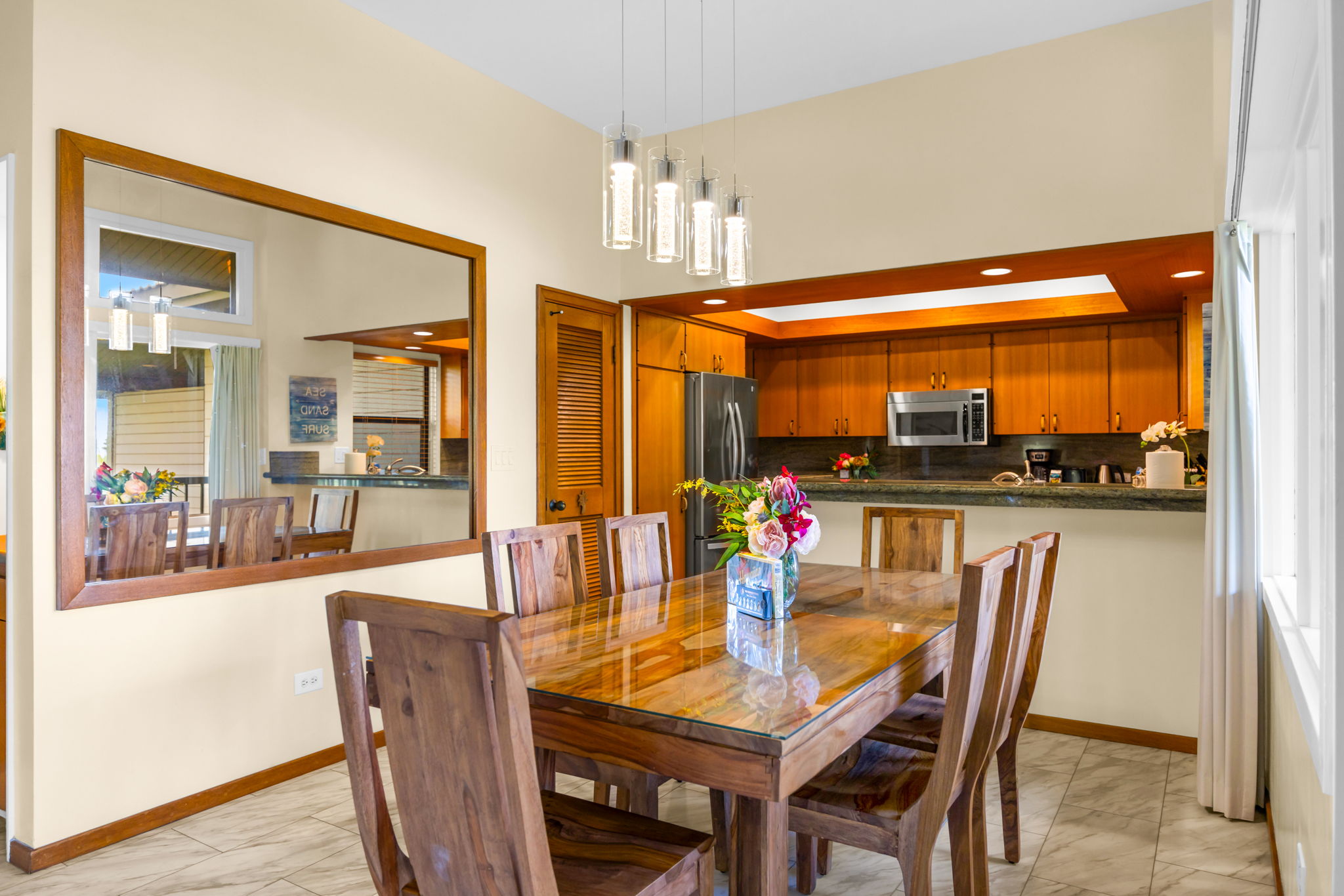 Window-side dining just steps from the kitchen and lanai.