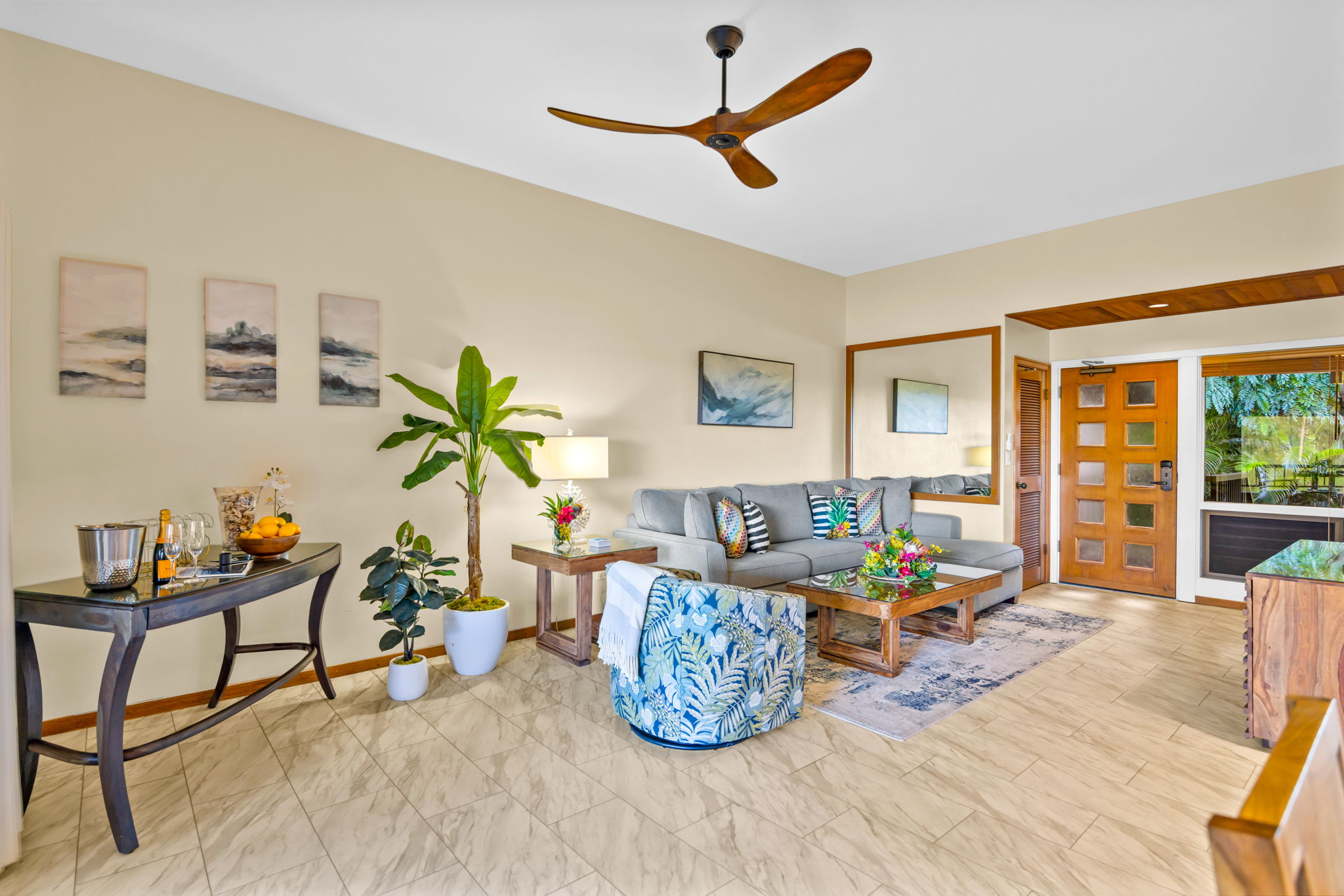 Crisp, coastal tones and wood accents define the main living area.