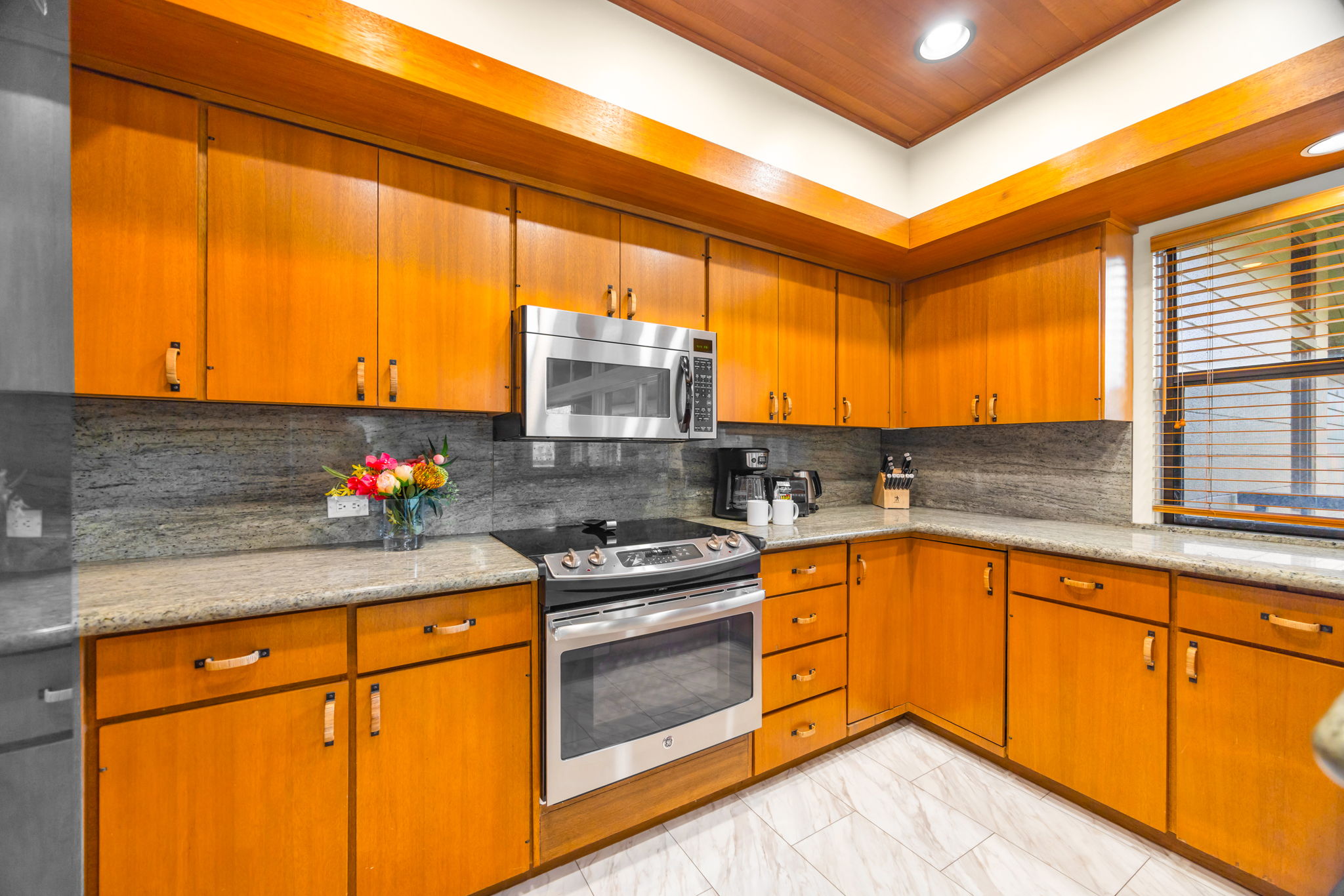 Full-size appliances and granite counters for easy home-style meals.