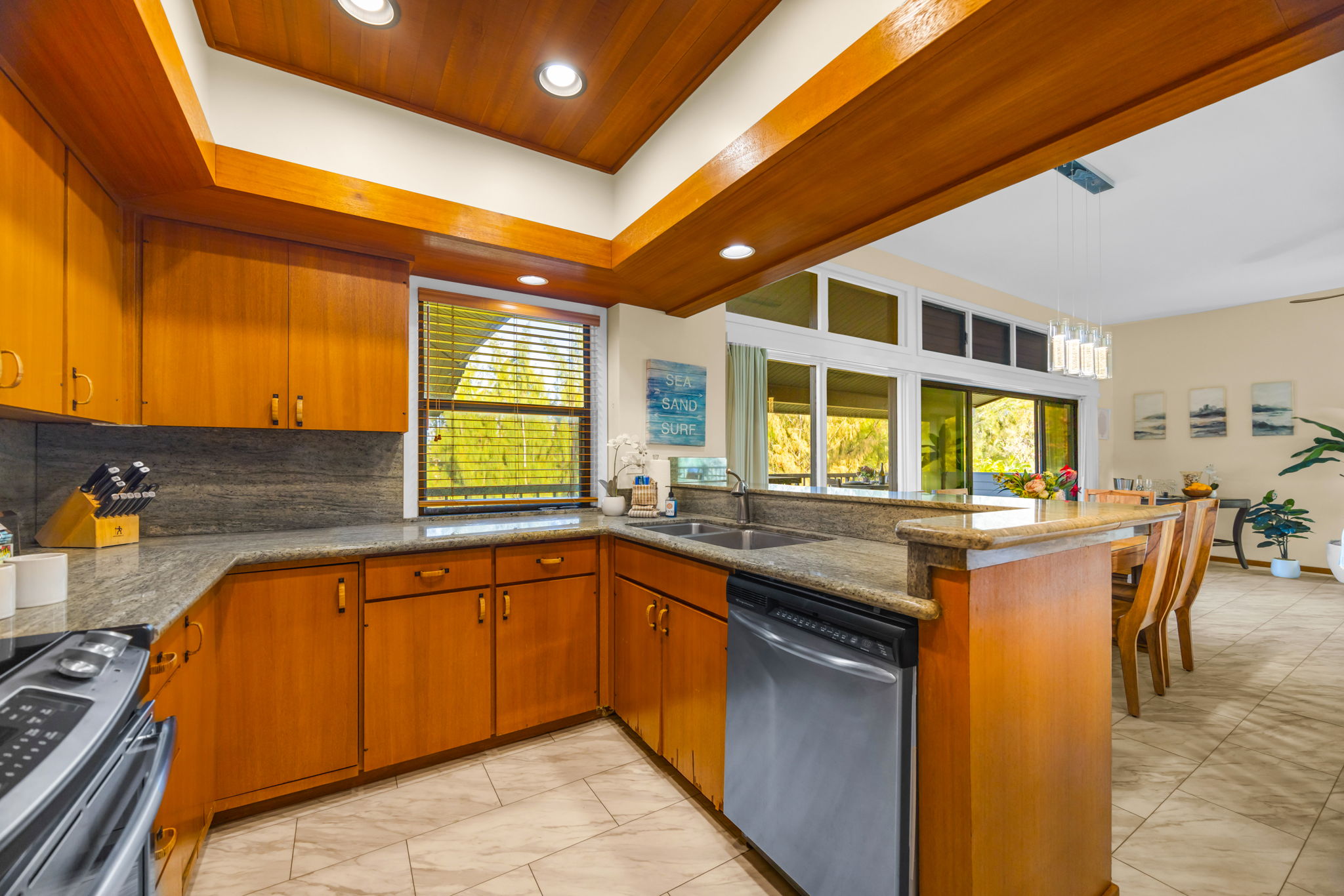 Wide layout with stainless steel appliances and plenty of prep space.
