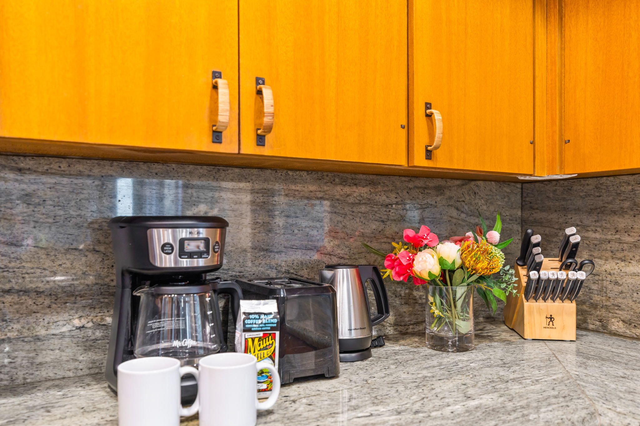 Coffee station and tropical flowers add a cheerful morning touch.