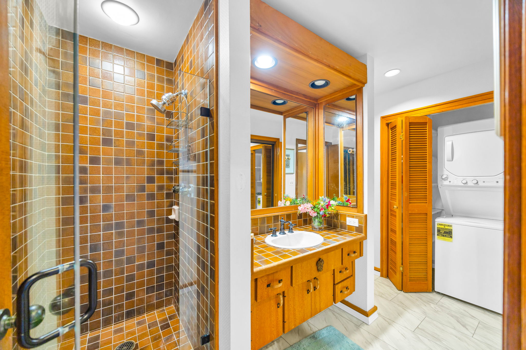 Granite vanity and full-size mirror in your second bathroom.