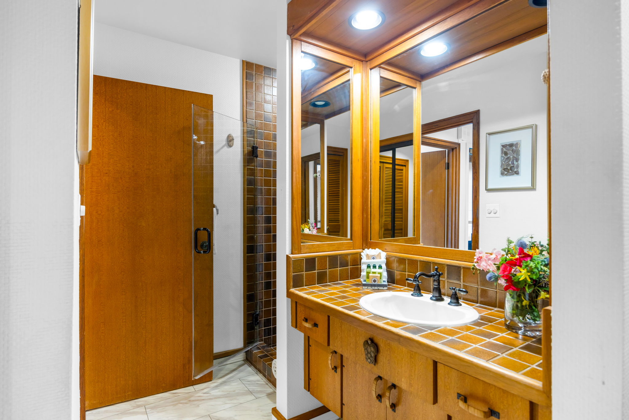 Well-appointed guest bathroom with updated finishes.