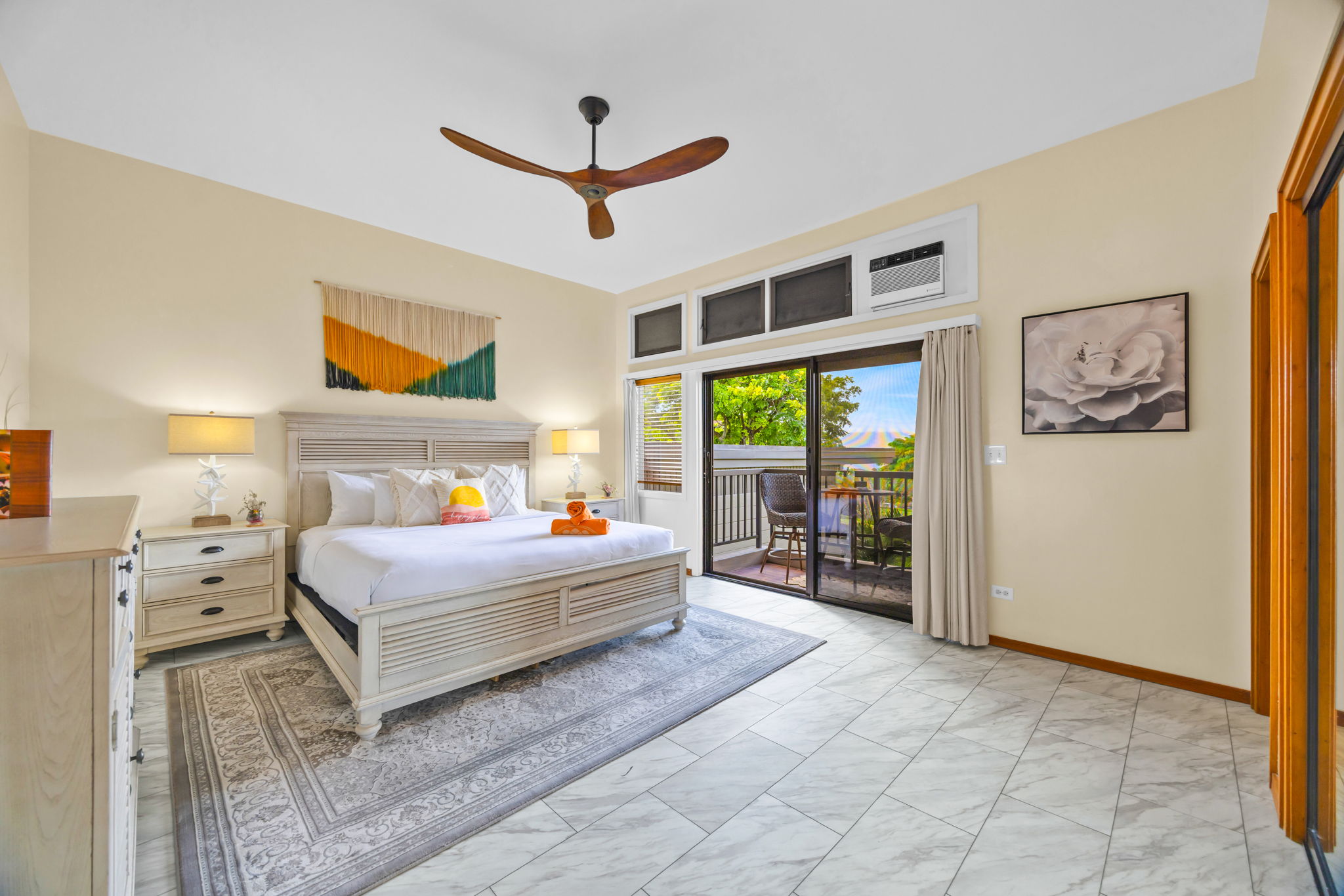 Primary bedroom with ample storage and ceiling fan comfort.