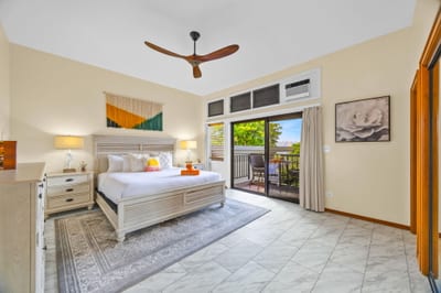 Primary bedroom with ample storage and ceiling fan comfort.