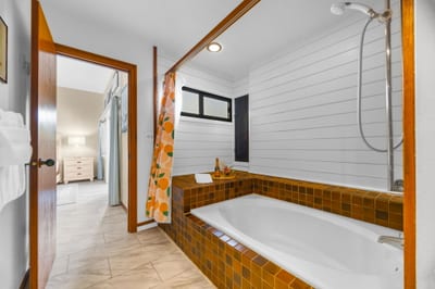 Deep soaking tub for unwinding after a beach day.