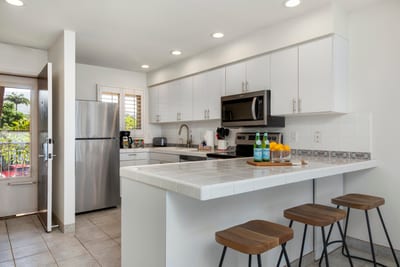 This polished kitchen glows like morning sunshine—bright, clean, and ready for coconut pancakes or island prosecco