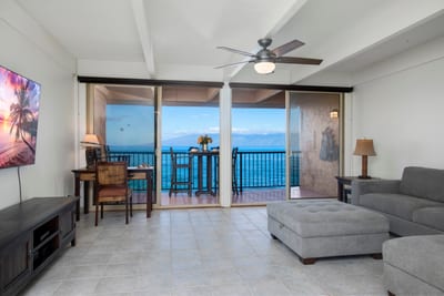 Lounge in comfort with the sea as your backdrop—this living room offers panoramic views just beyond the glass
