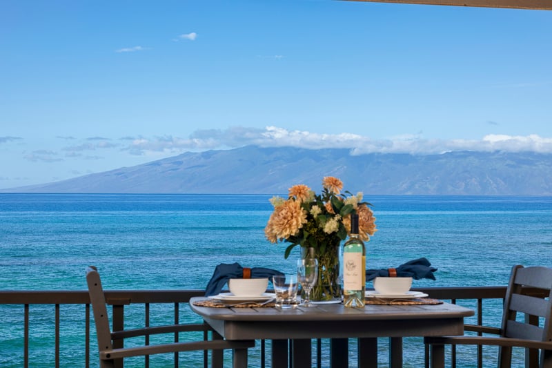 Sip wine on the lanai as waves sparkle below and palm trees sway beneath the glow of golden island skies