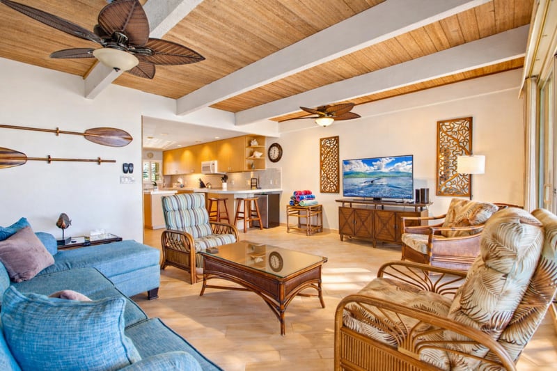 From your sofa, watch waves roll in through expansive glass doors that connect indoor comfort with fresh ocean air.