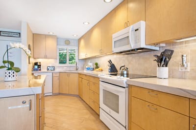 Your fully equipped kitchen features generous counter space and bar seating, making it easy to serve breakfast before the beach.