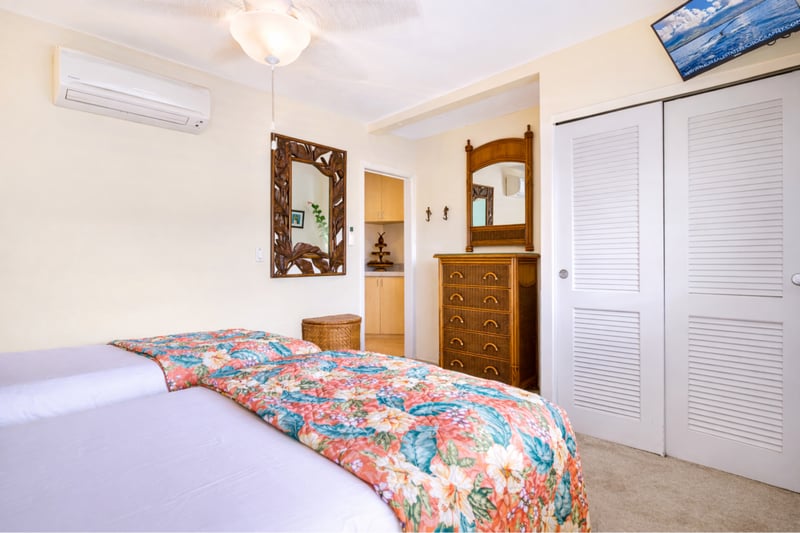 Colorful bedding and classic wood furnishings give your bedroom a relaxed island feel for a comfortable nights rest.