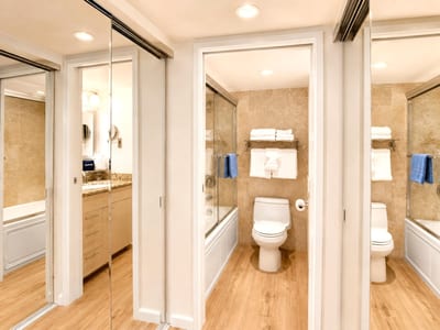 The bathroom features full length mirrors, making getting ready a breeze