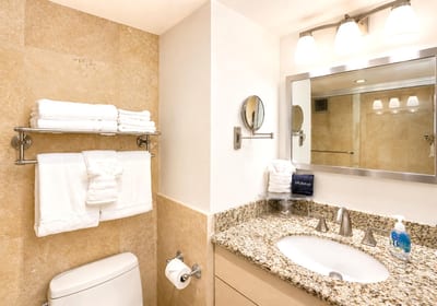 The bathroom offers a generous granite vanity with ample space for your vacation essentials