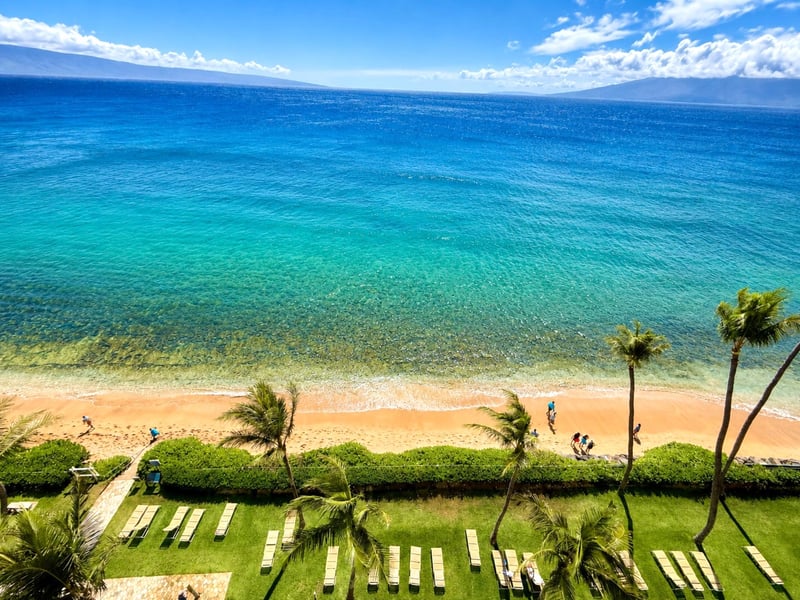 Panoramic oceanfront views stretch across the sparkling Pacific from your private lanai