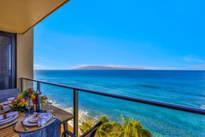 Stretch out in the living area with plush seating and a wall of glass that keeps the ocean front and center.