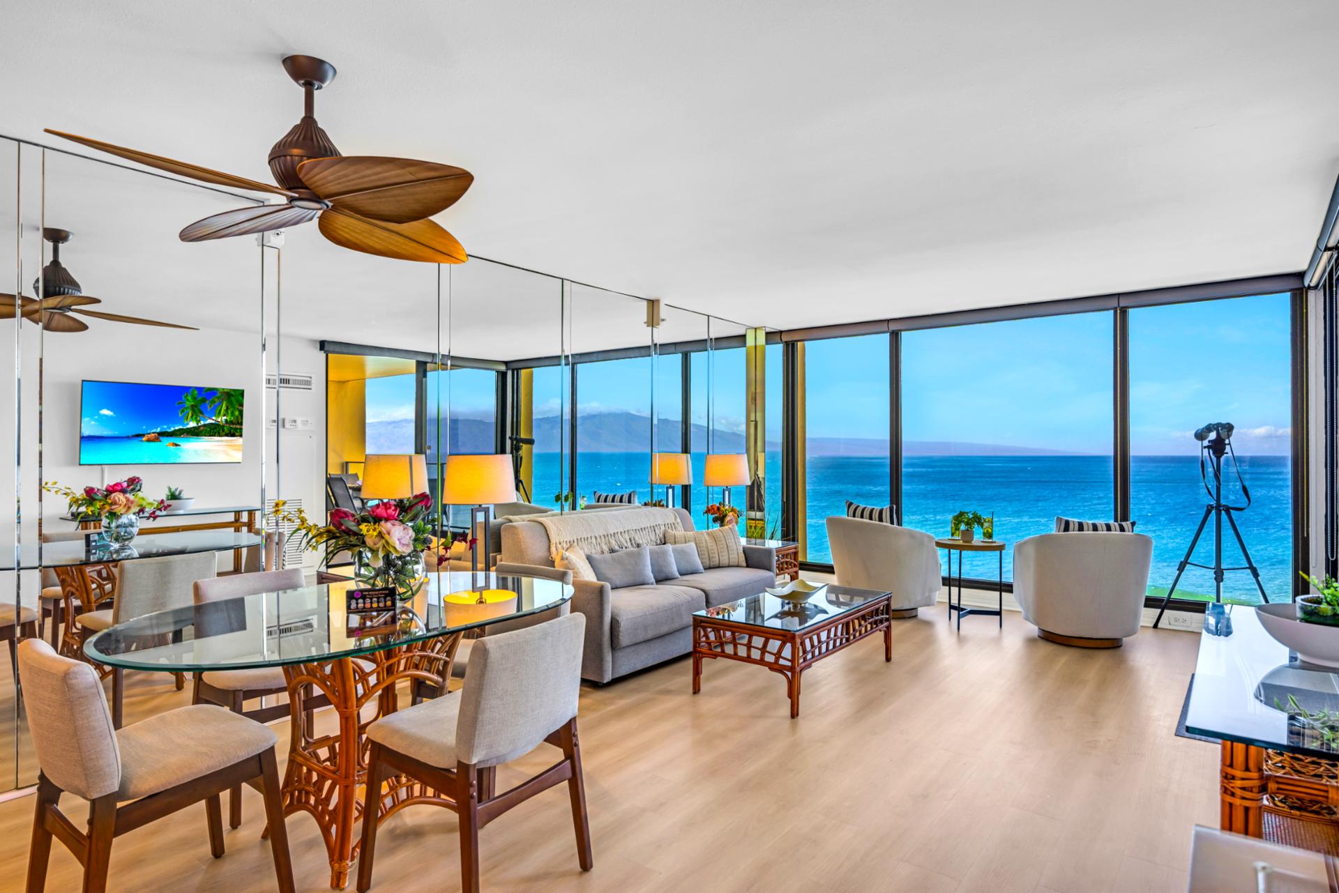 Gather at the dining table with ocean views all around, an easy spot for meals, games, and planning beach days.