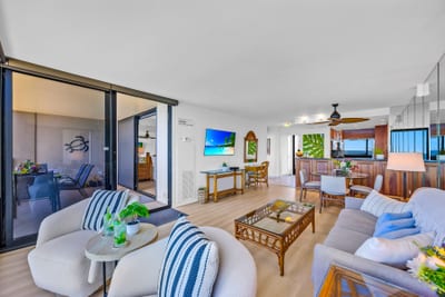 This living room keeps everything simple and scenic, comfortable seating, airy layout, and that ocean backdrop.