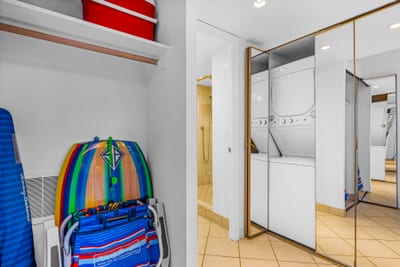 A convenient in unit laundry setup keeps beach towels and resort wear fresh throughout your stay, allowing you to pack light.