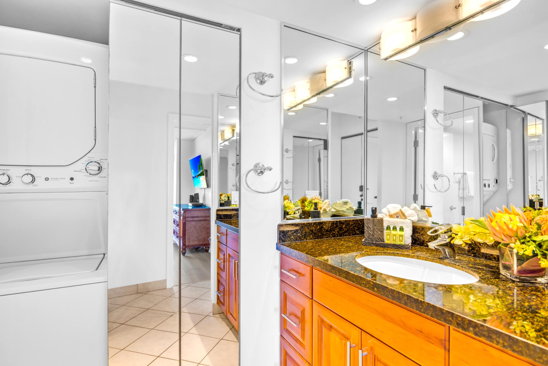 Enjoy a bright bathroom with a glass shower and plenty of counter space for getting ready after the beach.