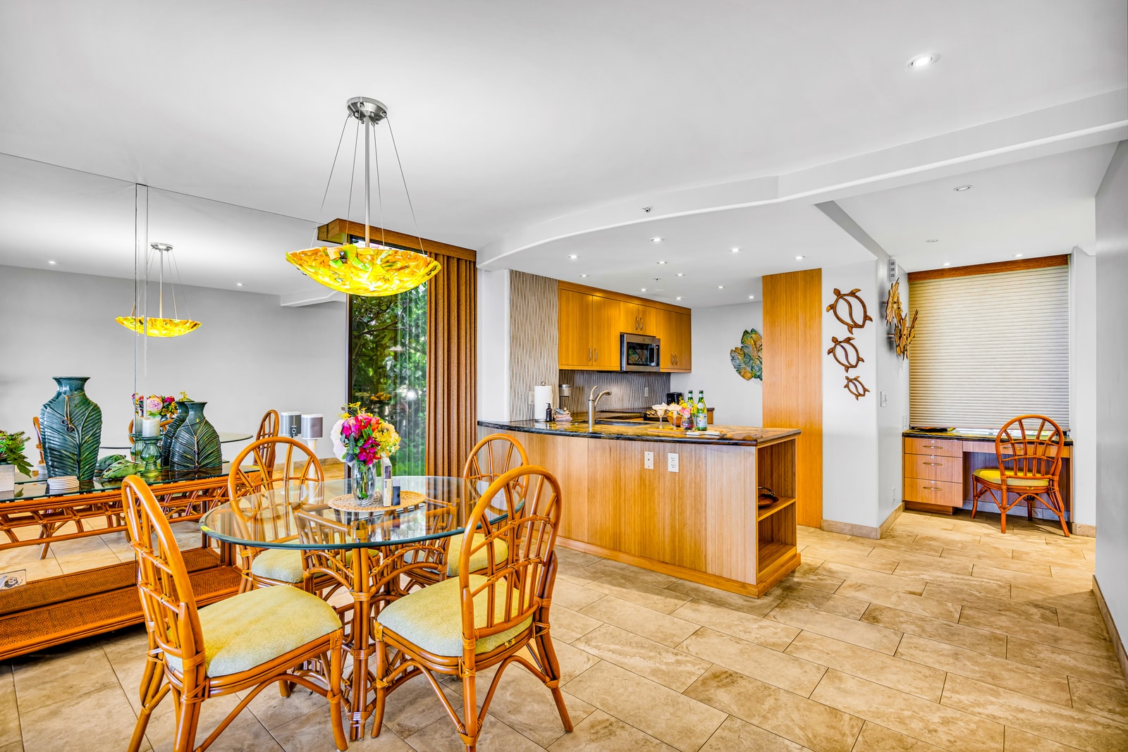 Gather at your dining table for four just steps from the kitchen and lanai. MAH-109