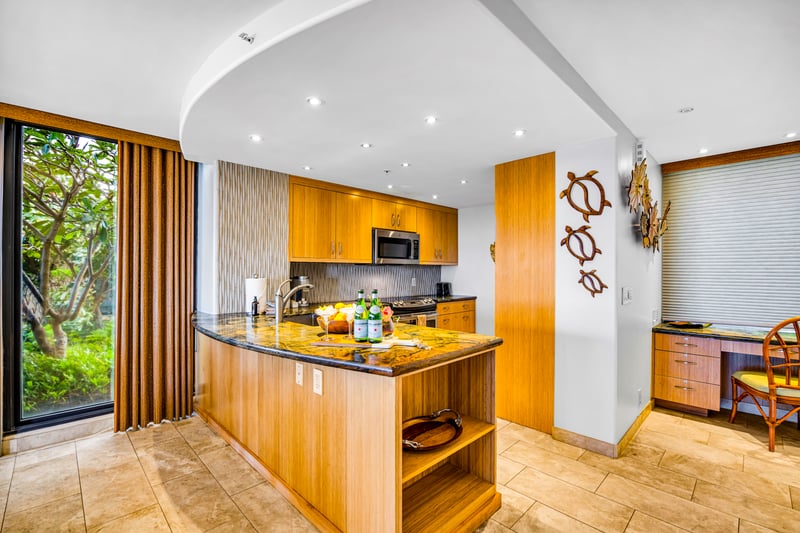 Kitchen layout offers ample storage and full-size appliances.