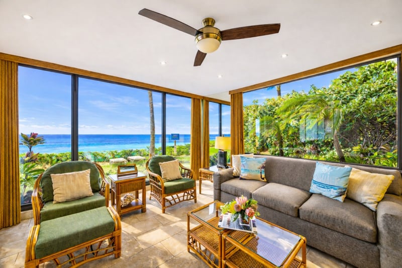 Cozy up for a quiet night or open the doors wide to enjoy ocean air in this central living space.