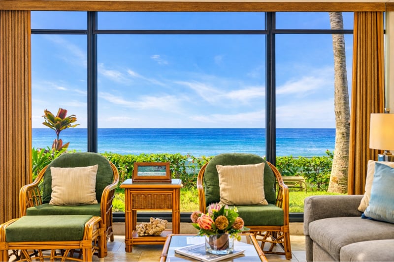 Floor-to-ceiling windows bring the ocean indoors, creating a breezy, open feel in the living space.