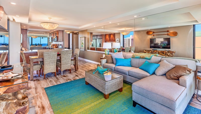 The open layout lets laughter drift from kitchen to couch like a breeze through the palms—light, easy, unforgettable