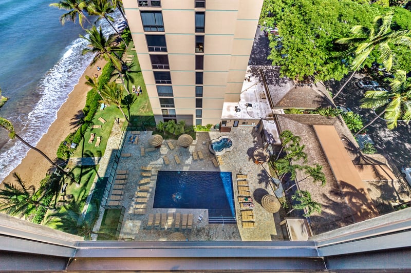 From this sky-high view, soak in paradise—where poolside bliss, swaying palms, and sandy shores are just steps away