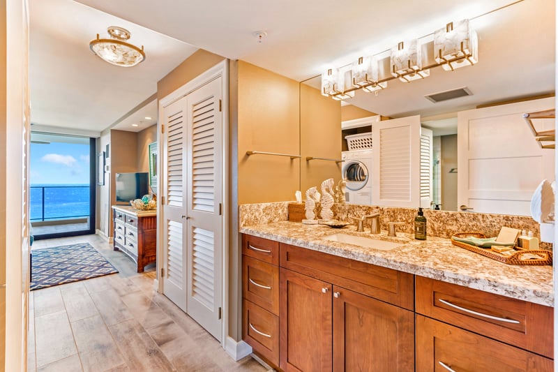 Framed by sunset tones and fine finishes, this master bath invites you to linger, lounge, and luxuriate