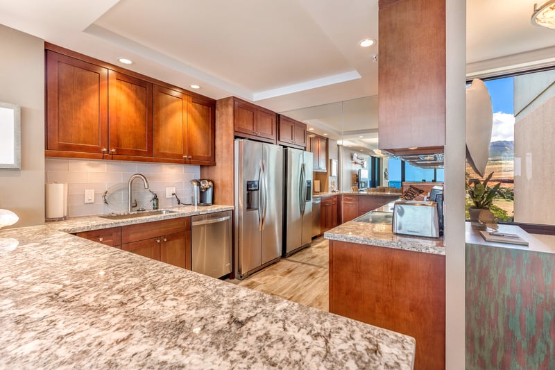 The kitchen bends gently toward the horizon, its lines echoing the sweep of tide and the cadence of oceanic time