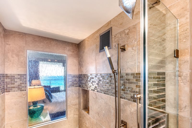 Greet your mornings with ocean light and golden shimmer, as this spa-like bath flows with calm and coastal elegance