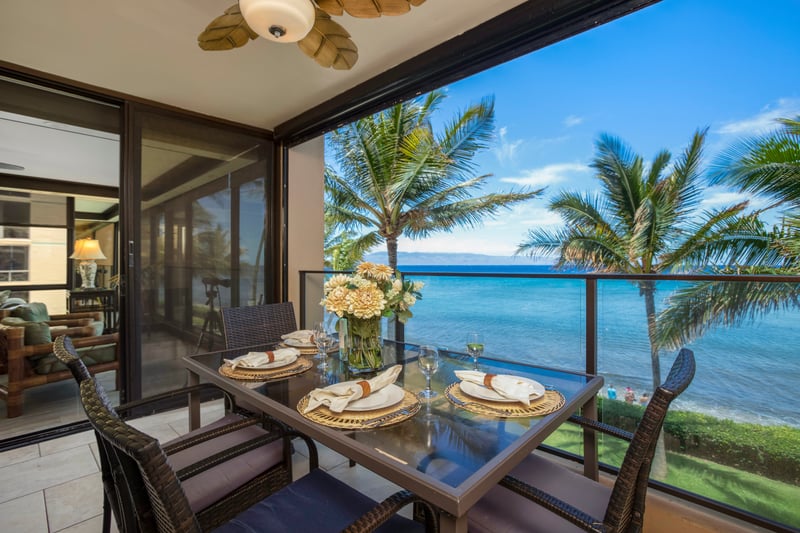 This lanai is where coffee meets coconut-scented dreams, and breakfast lingers long with the ocean as your company