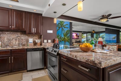 This kitchen gleams like a well-polished secret, where stainless steel appliances flirt with rich cherrywood charm MAH-301