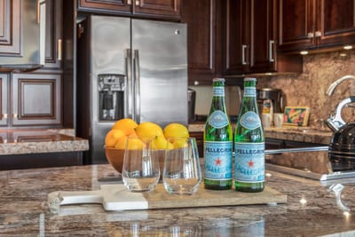 Arrive to a refreshing welcome—sparkling water, fresh citrus, and a gourmet kitchen that’s ready for any craving MAH-301