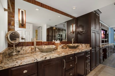Step into this marble masterpiece where granite dreams come true and vessel sinks sit like golden thrones of cleanliness. MAH-301