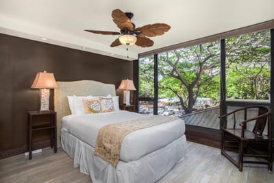 Tucked beneath a canopy of jungle green, this queen-sized bed offers royal comfort amid treetop whispers MAH-301