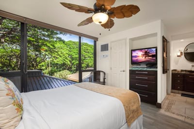 The queen bed rests like a poem in this nature-kissed retreat, perfect for slow mornings and slippered strolls MAH-301