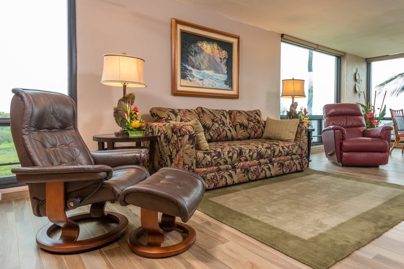 Settle into island serenity on a tropically patterned sofa with lush garden vibes and a view of endless skies