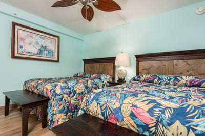 With colorful coverlets and hand-carved frames, these beds are a playful balance of tropical whimsy and relaxed elegance MAH-419
