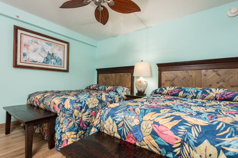 With colorful coverlets and hand-carved frames, these beds are a playful balance of tropical whimsy and relaxed elegance