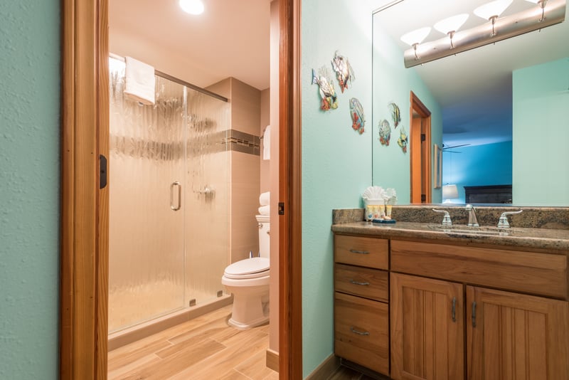 Where morning routines feel magical, with soft lighting, gleaming counters, and a calming woodsy embrace